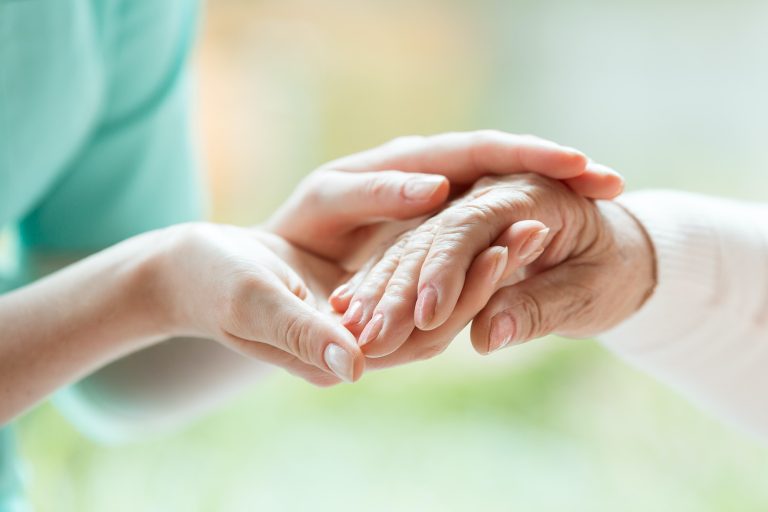 Senior person thanking the nurse